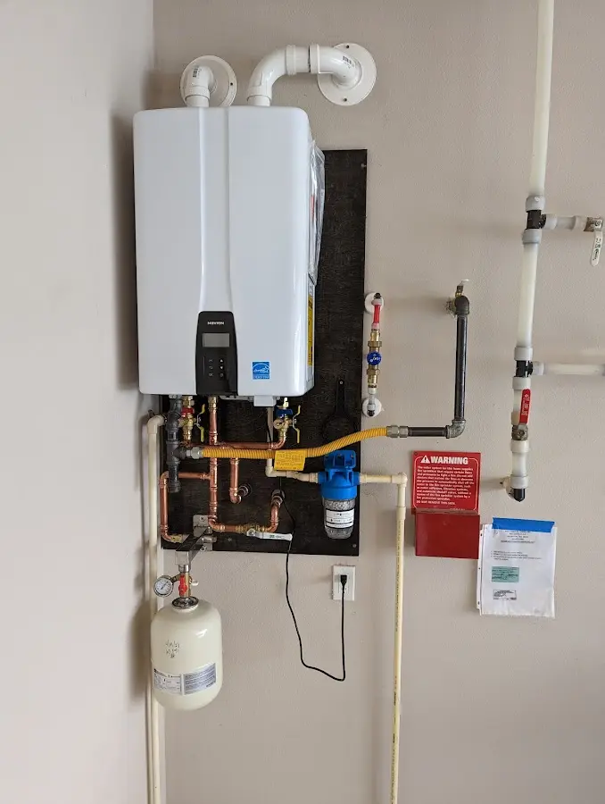 Professional plumber installing copper piping in a Lake of the Pines home